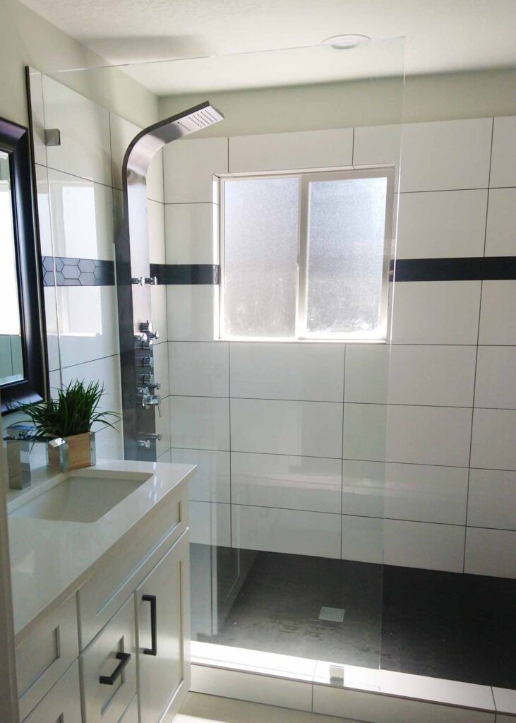 Modern Farmhouse Bathroom with half glass divider wall.